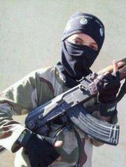A child wearing a hat with the Islamic State group logo poses with a weapon in Raqqa, Syria. This undated image was posted online and made available Nov. 20, 2014, by Raqqa Is Being Slaughtered Silently, an anti-Islamic State organization. The image has been verified and is consistent with other reporting by the Associated Press. (Photo: AP)