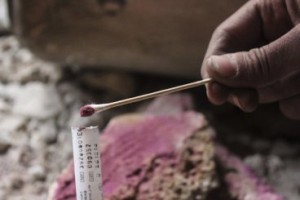 Syrian opposition members collect samples from the site of a suspected chlorine gas attack by Asad regime forces in Jobar region of Damascus, Syria on November 13, 2014.Getty Images