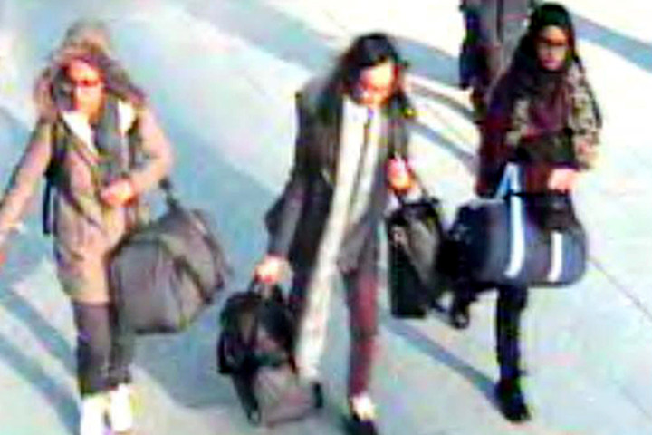 Amira Abase (from left), 15, Kadiza Sultana, 16, and Shamima Begum, 15, go through Gatwick airport, south of London, on Feb. 17.