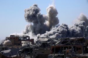 Smoke billows in Raqqa on Sept. 3, 2017, as Syrian Democratic Forces, a U.S. backed Kurdish-Arab alliance, battle to retake the city from the Islamic State group. Delil Souleiman/AFP/Getty Images